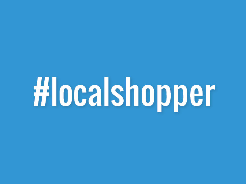 Blauer Hintergrund mit Hashtag Schriftzug #localshopper auf blauen Hintergrund