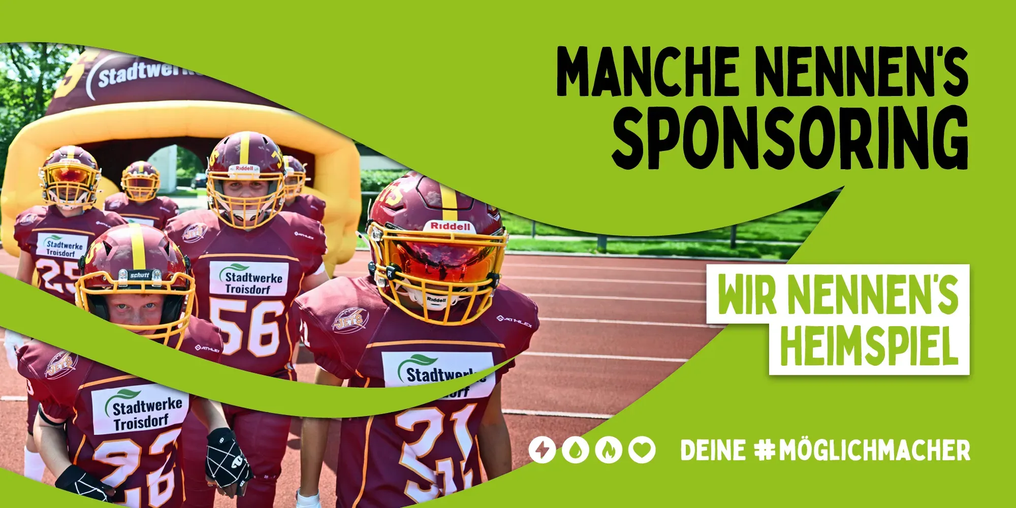 Eine Footballmannschaft läuft auf das Spielfeld